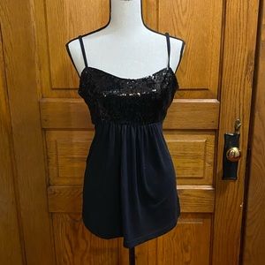 Black dressy tank top with open back.